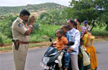 The story behind the viral photo of an Andhra cop folding hands before a family